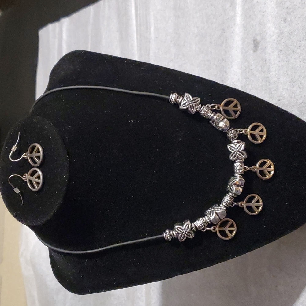 Piece symbol necklace and earrings set